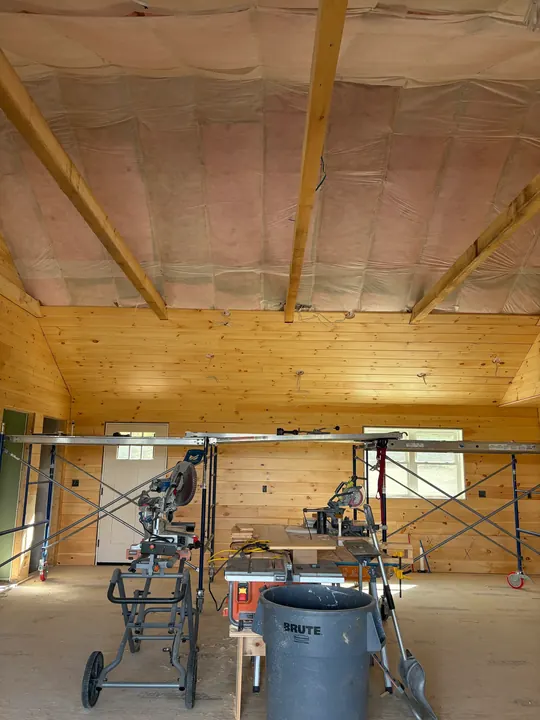 Pine walls finished with insulated ceiling and saws set up below