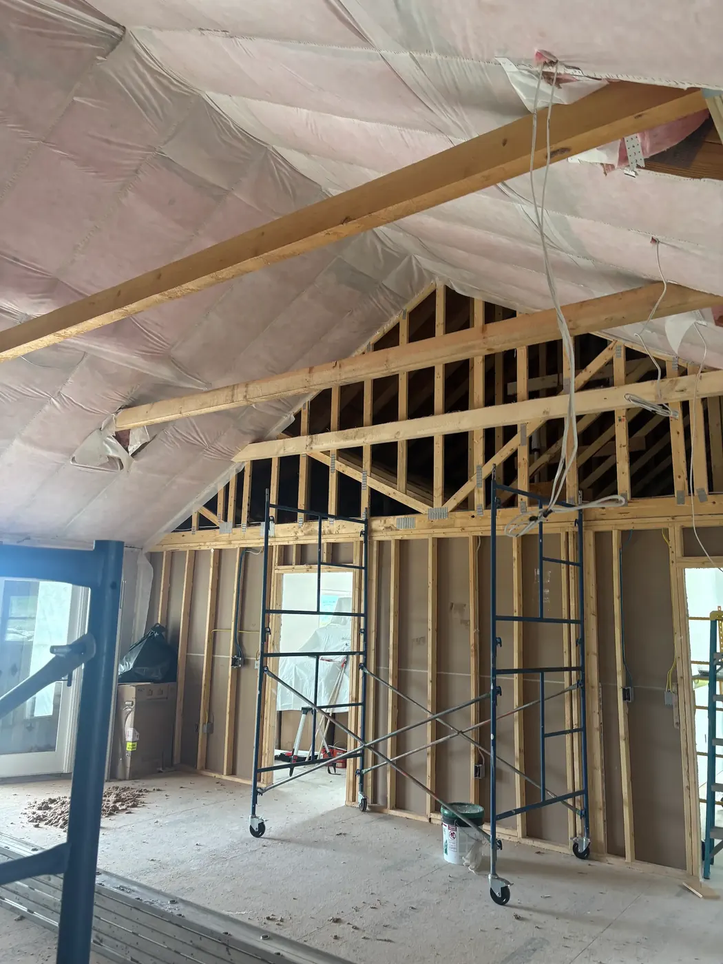 Insulation installed in a vaulted ceiling over new framing