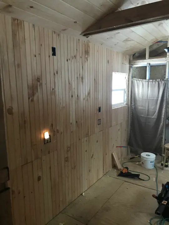 Pine paneled walls finished around a window